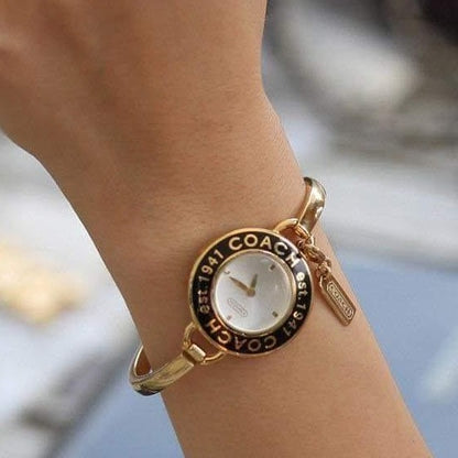 Phoebe Quartz Black Bezel, White Dial, Golden Stainless Steel Ladies Bangle